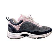 Side view of Chanel G34360 pink and grey tweed sneaker with tonal interlocking CC logo