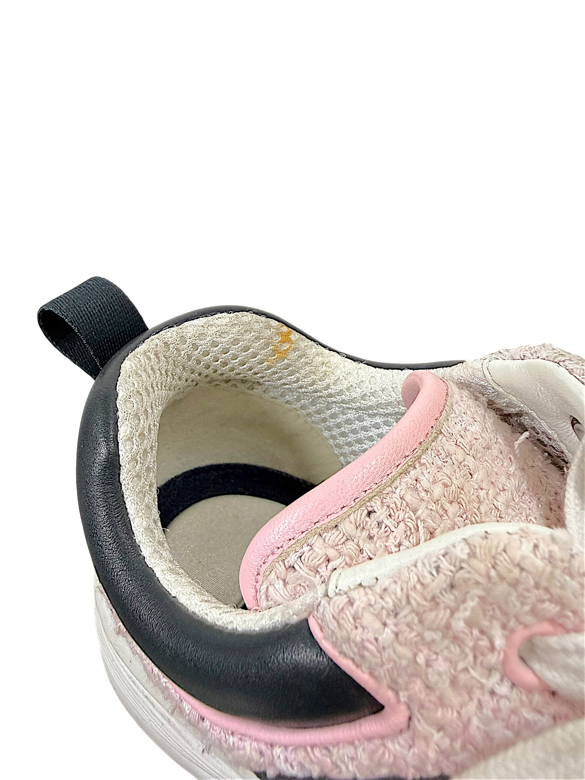 Interior condition detail of Chanel pink tweed sneaker showing light soiling near the inner collar