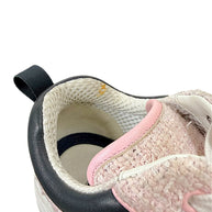 Interior condition detail of Chanel pink tweed sneaker showing light soiling near the inner collar