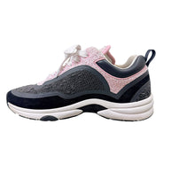 Opposite side profile of Chanel pink grey and black tweed low-top sneaker