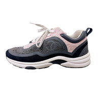Side profile of Chanel G34360 grey and pink tweed sneaker with black suede trim