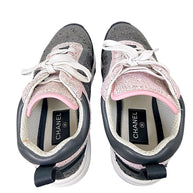 Interior view of Chanel tweed sneakers showing insoles, lining and light interior soiling
