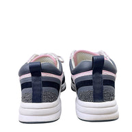 Rear view of Chanel G34360 tweed sneakers showing black heel pull tabs and layered construction