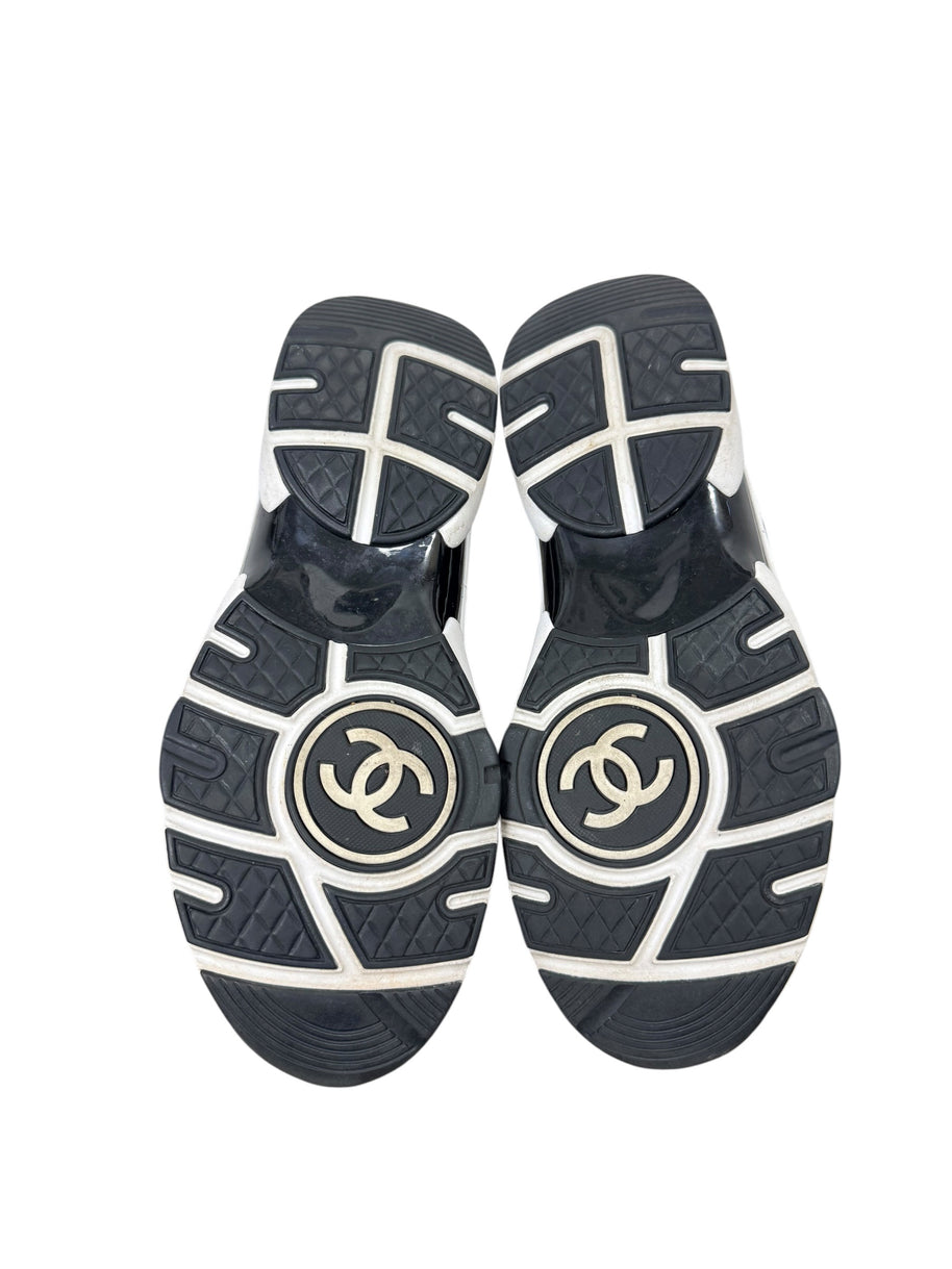Chanel G34360 sneaker outsoles showing interlocking CC logos and wear consistent with age and use