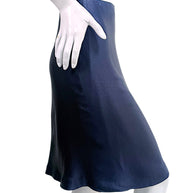 Side profile view of Chanel Identification Collection navy metallic skirt showing soft movement and silhouette.