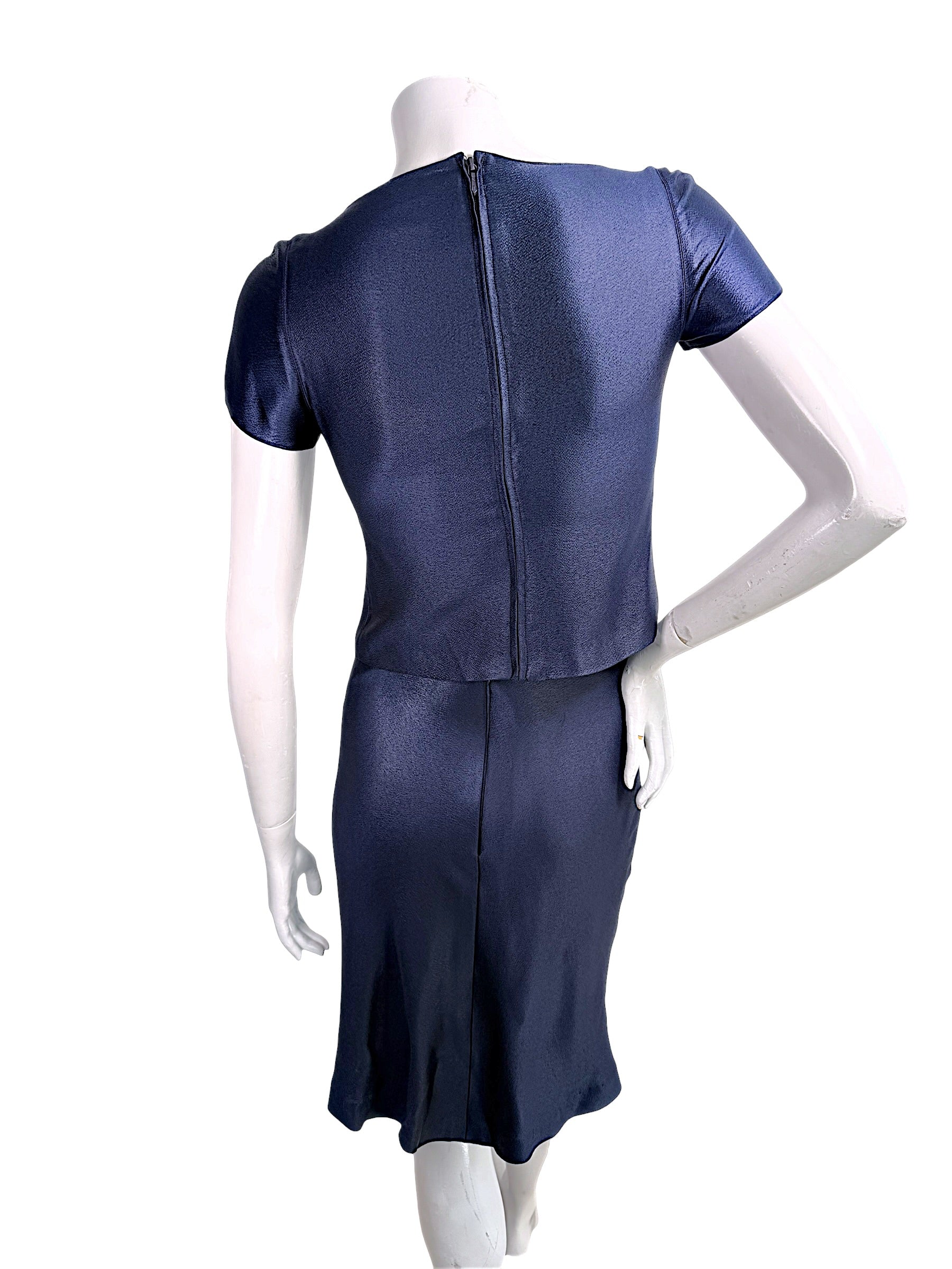 Back view of vintage Chanel Identification Collection navy metallic coordinated top and skirt set with concealed zipper closure.