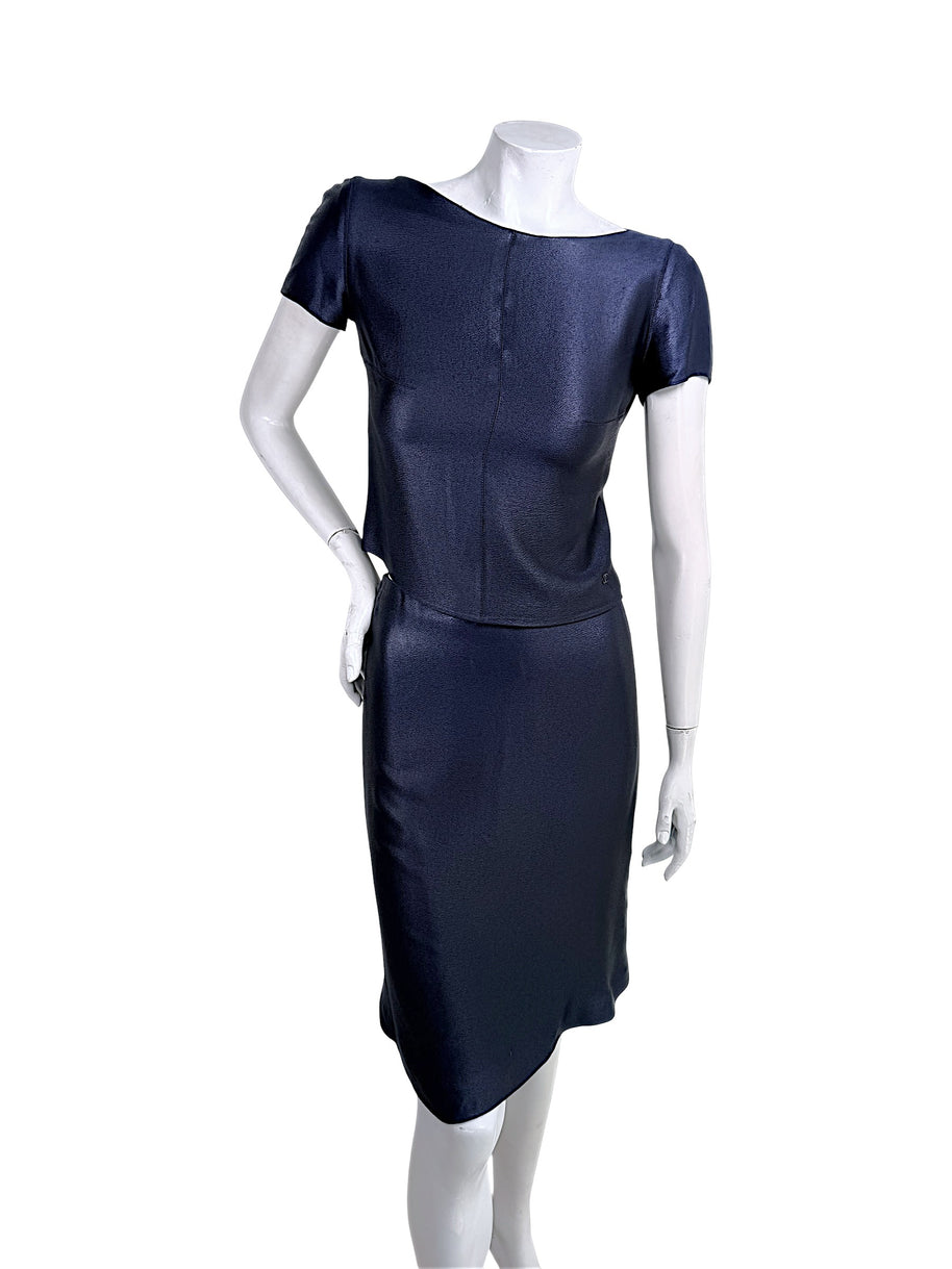 Vintage Chanel Identification Collection navy metallic two-piece skirt set front view featuring short sleeve bateau neckline top and coordinating skirt with subtle CC logo hardware.