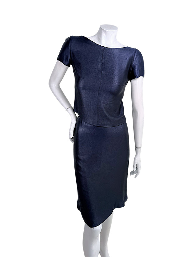 Vintage Chanel Identification Collection navy metallic two-piece skirt set front view featuring short sleeve bateau neckline top and coordinating skirt with subtle CC logo hardware.