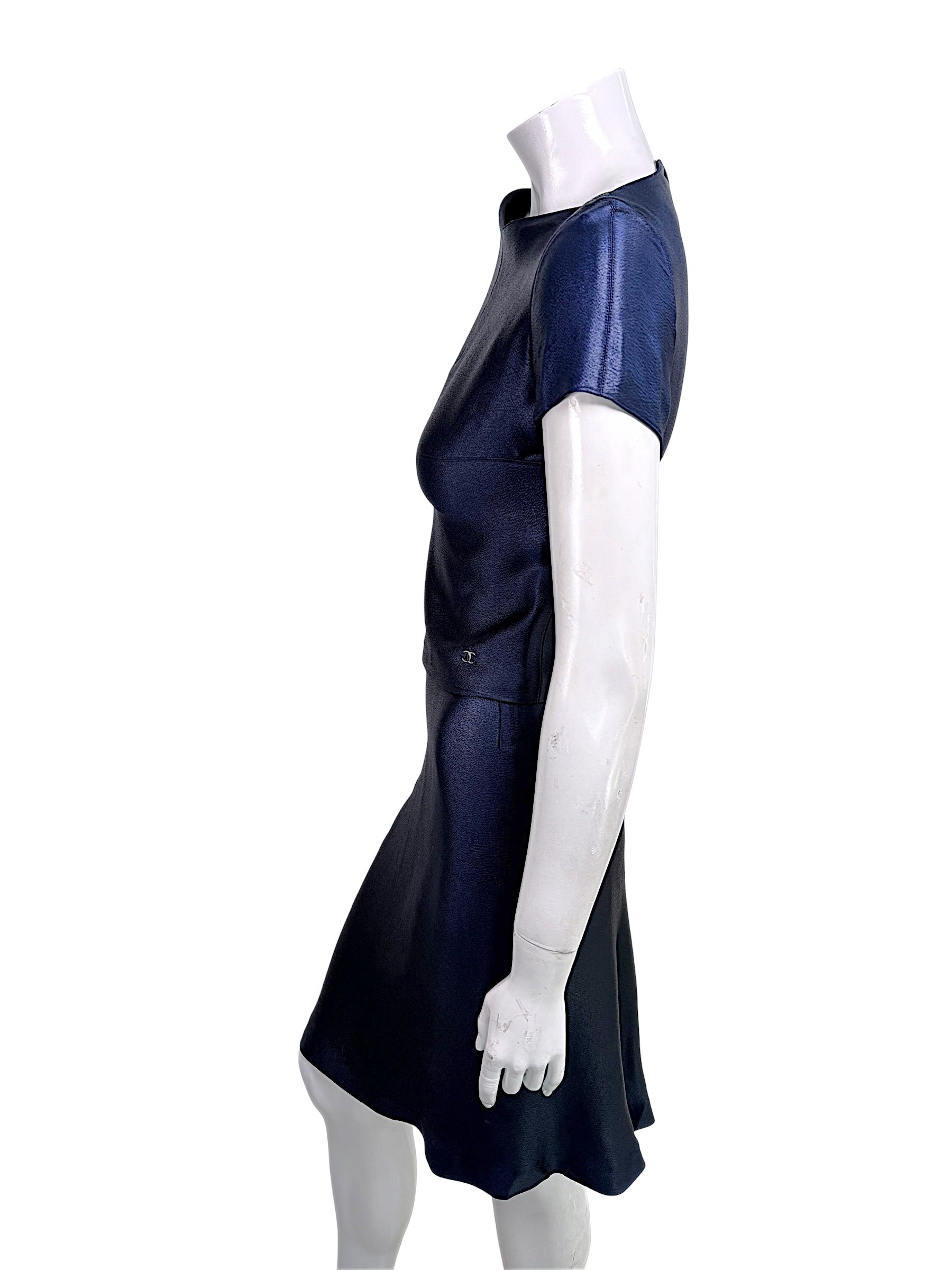 Side profile of vintage Chanel navy metallic Identification Collection skirt set showing drape and silhouette.