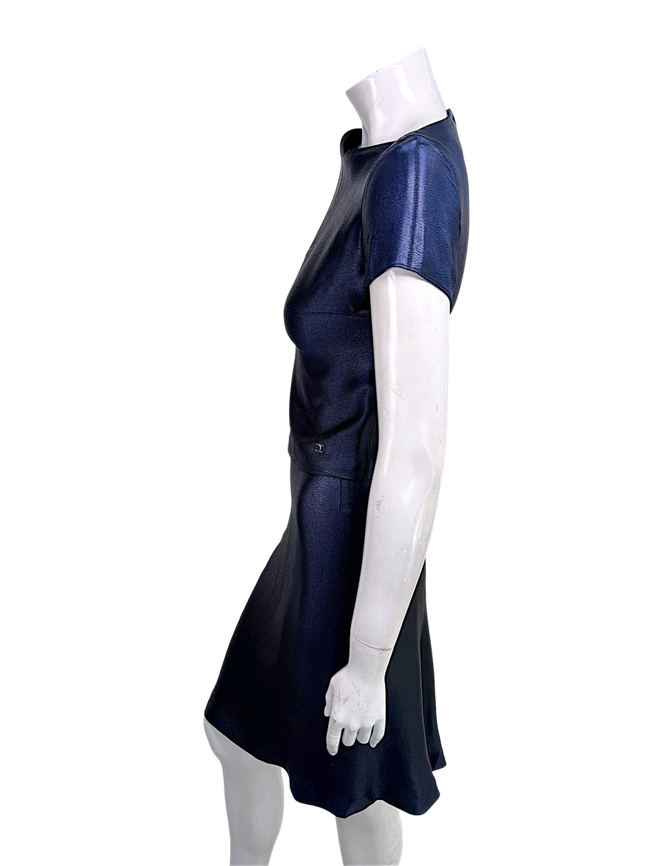 Side profile of vintage Chanel navy metallic Identification Collection skirt set showing drape and silhouette.