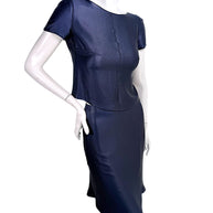 Three-quarter front view of Chanel Identification Collection navy metallic two-piece skirt set with minimalist silhouette.