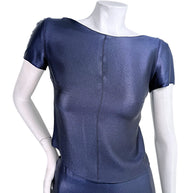 Close-up of vintage Chanel Identification Collection navy metallic top featuring textured luminous fabric and bateau neckline.