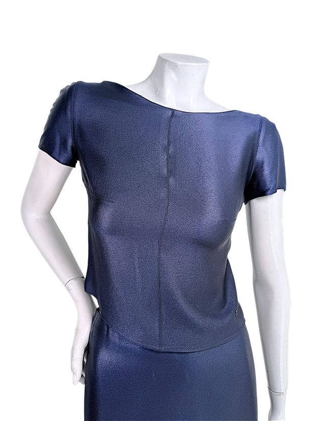 Close-up of vintage Chanel Identification Collection navy metallic top featuring textured luminous fabric and bateau neckline.