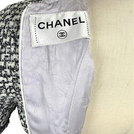Authentic Chanel interior label detail on tweed mini dress