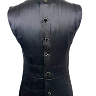 Close-up rear detail of Chanel black satin dress with black enamel and gold-tone logo buttons.