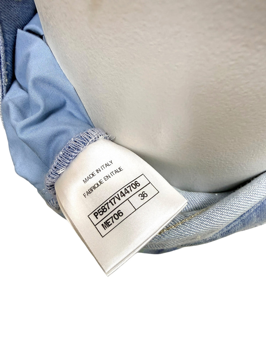 Chanel made in Italy interior garment tag showing collection code and size information for Spring 2006 denim jeans.
