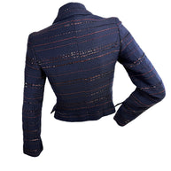 Chanel navy tweed jacket back view with structured seams and burgundy sequin accents