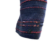 Chanel CC logo detail on sleeve cuff navy tweed with sequin embellishment close up