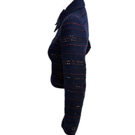 Chanel navy tweed jacket side profile showing fitted waist and sequin stripe detailing