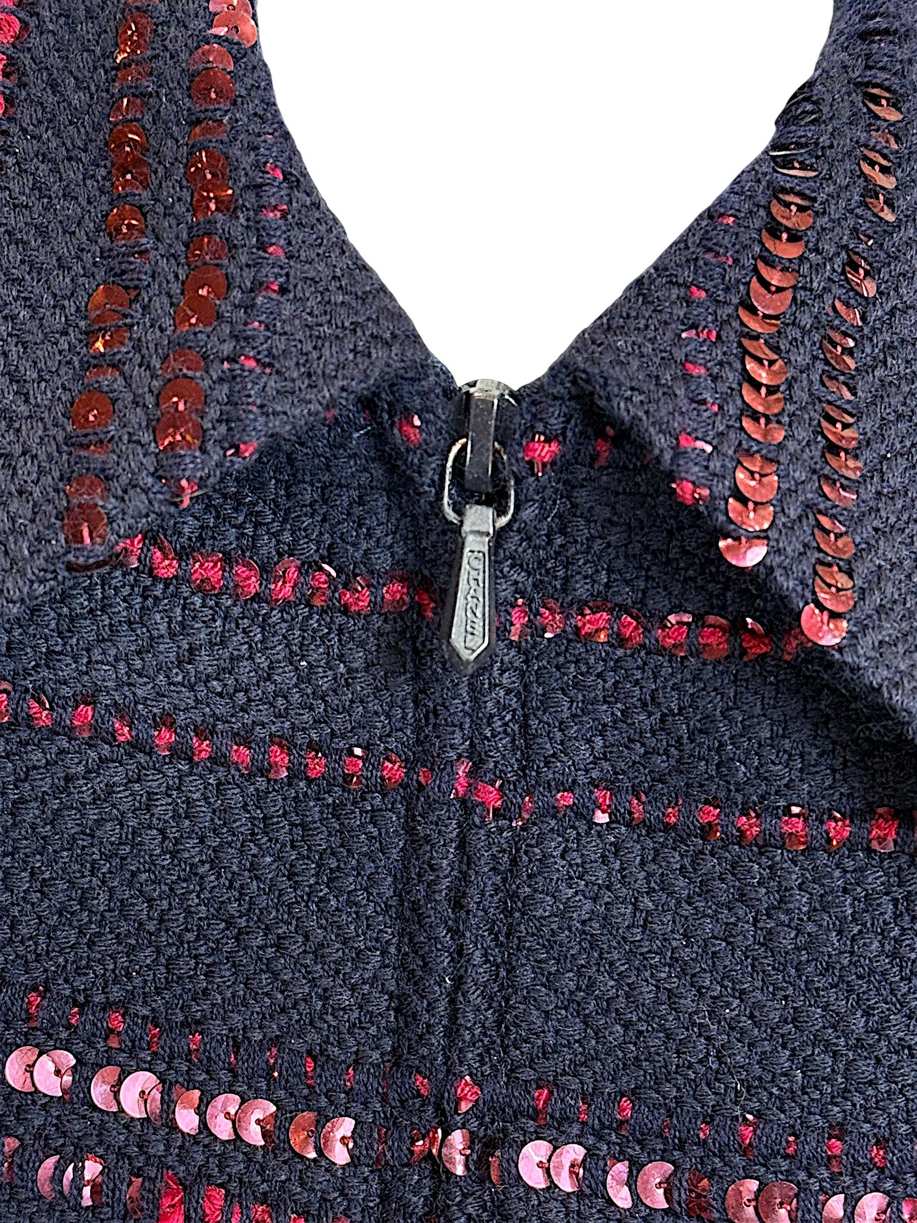 Chanel jacket zipper detail with navy tweed and burgundy sequin trim close up