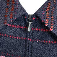 Chanel jacket zipper detail with navy tweed and burgundy sequin trim close up