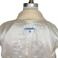 Interior Chanel label with signature camellia jacquard silk lining from the Pre-Fall 2010 Paris-Shanghai runway jacket.