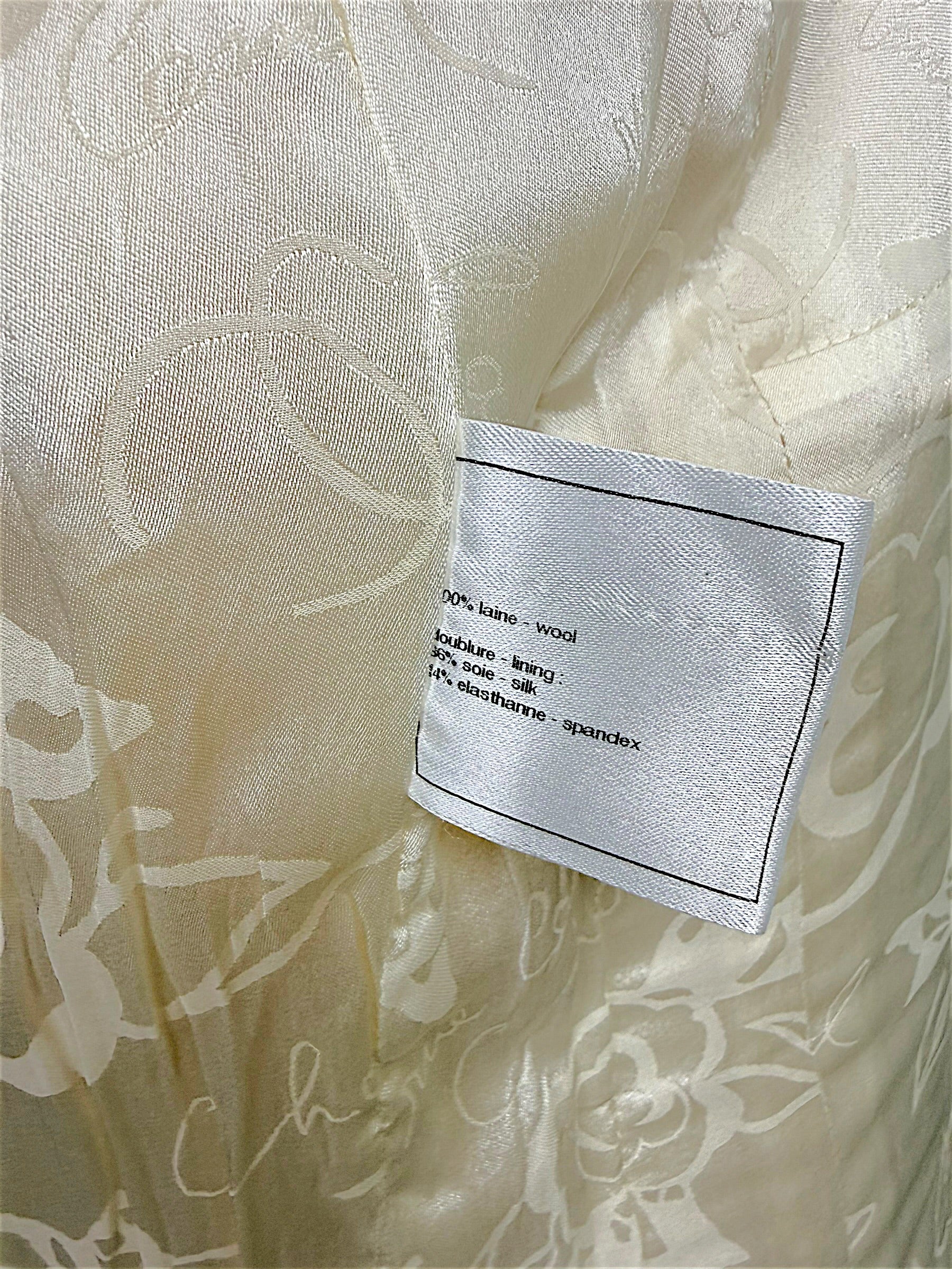 Close-up of Chanel composition label showing fabric content inside the Pre-Fall 2010 runway jacket.