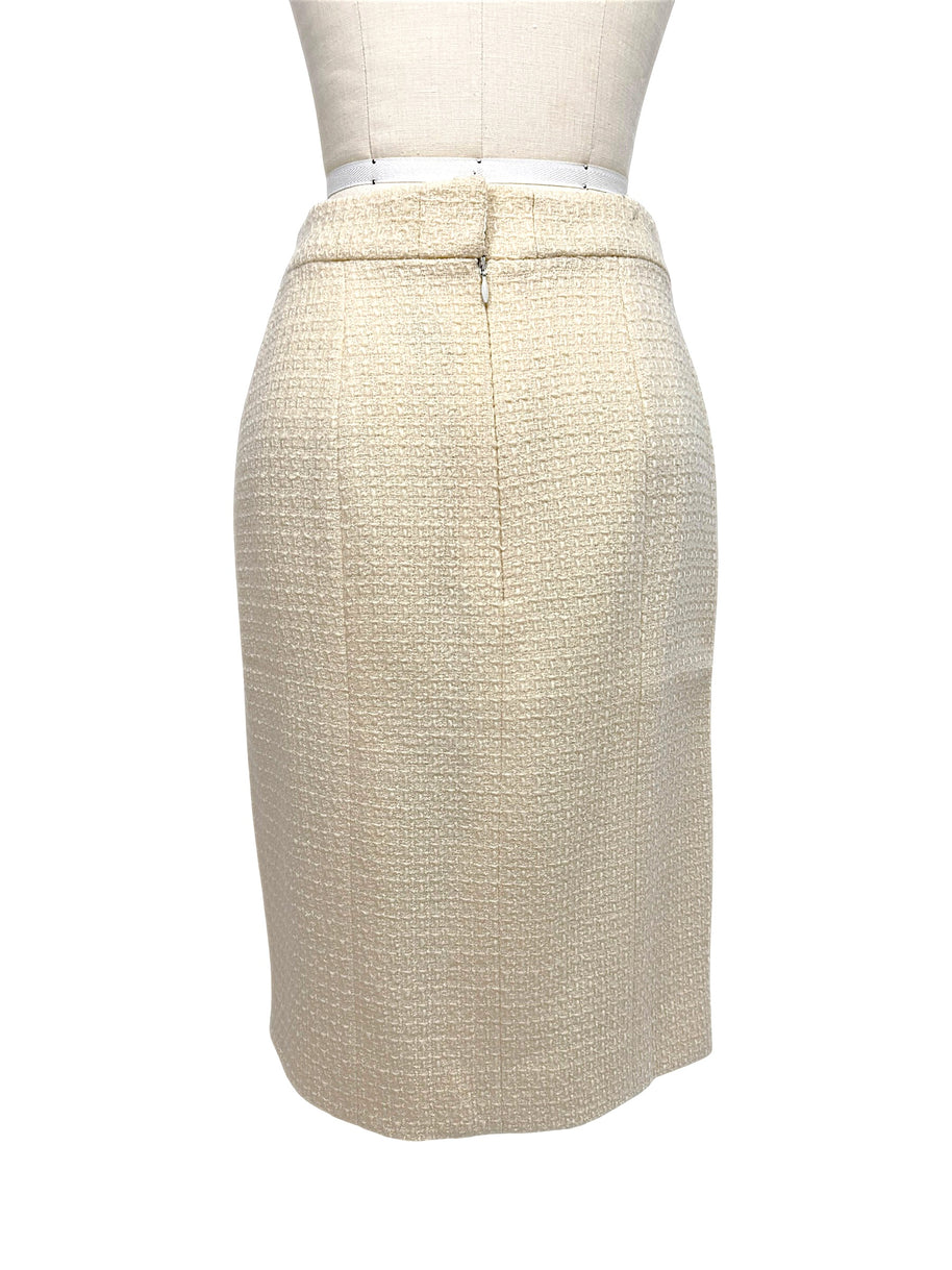Rear view of Chanel Pre-Fall 2010 ivory bouclé pencil skirt featuring a streamlined tailored silhouette.