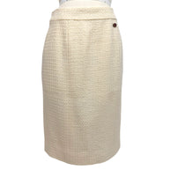 Front view of Chanel Pre-Fall 2010 ivory bouclé pencil skirt with clean tailored silhouette from the documented runway ensemble.
