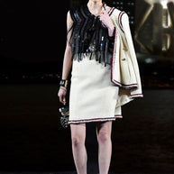 Documented Chanel Pre-Fall 2010 Paris-Shanghai Métiers d'Art Runway Look 42 featuring an ivory bouclé skirt suit with signature braided trim designed by Karl Lagerfeld.
