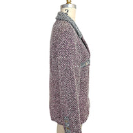 Side profile of vintage Chanel Spring 1996 tweed blazer with structured tailoring and cuff button detailing
