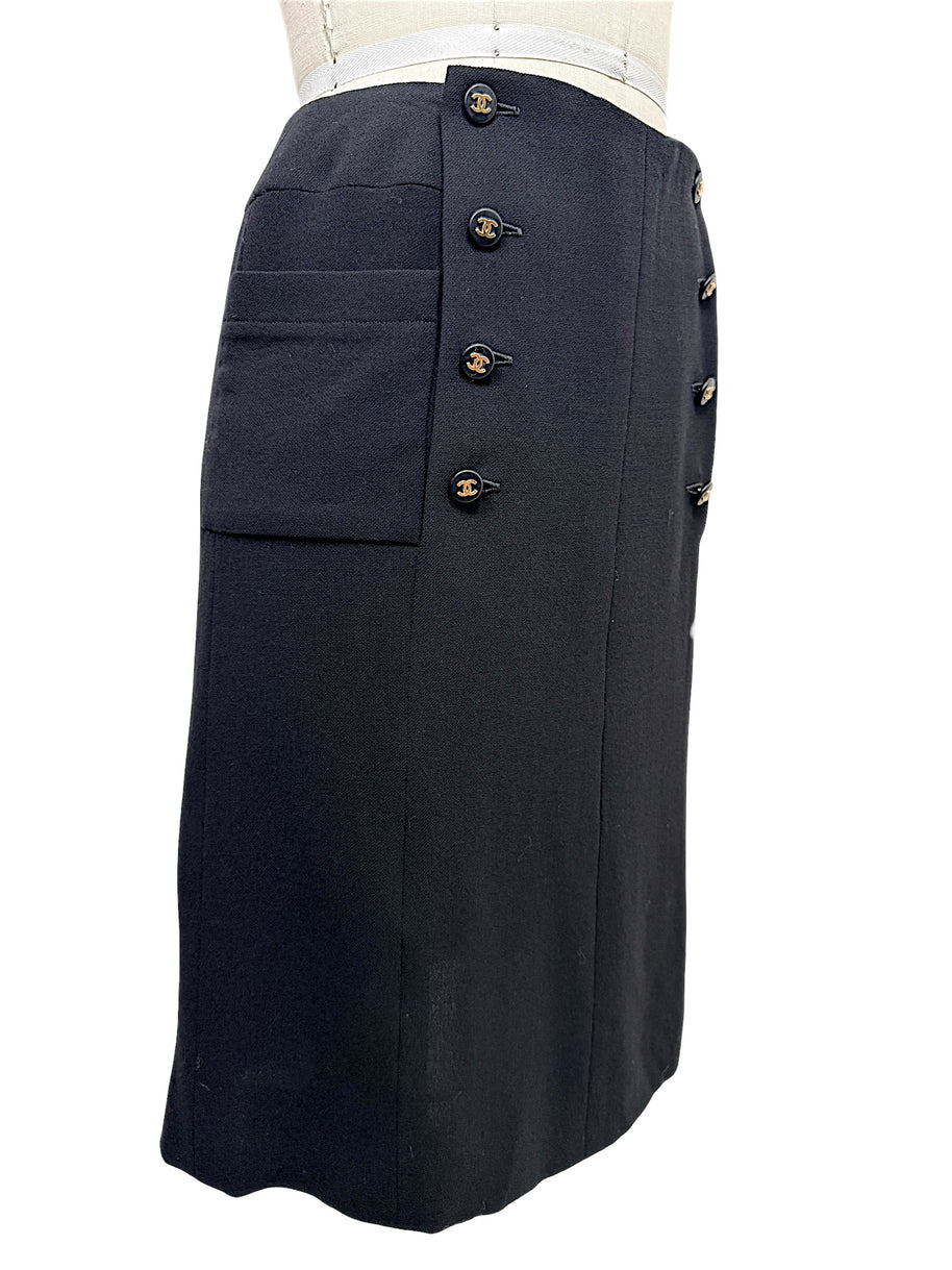 Chanel Spring 1997 black midi skirt with gold CC buttons and oversized patch pocket, left side view