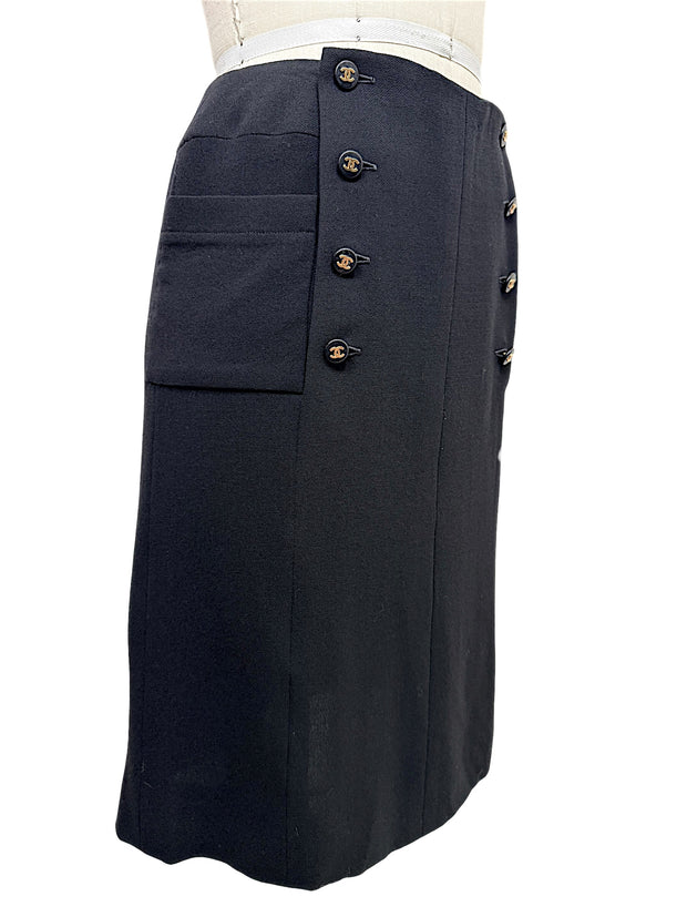 Chanel Spring 1997 black midi skirt with gold CC buttons and oversized patch pocket, left side view