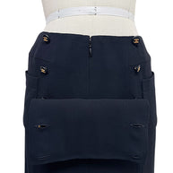 Close-up of vintage Chanel Spring 1997 black skirt with gold CC logo buttons and oversized patch pocket