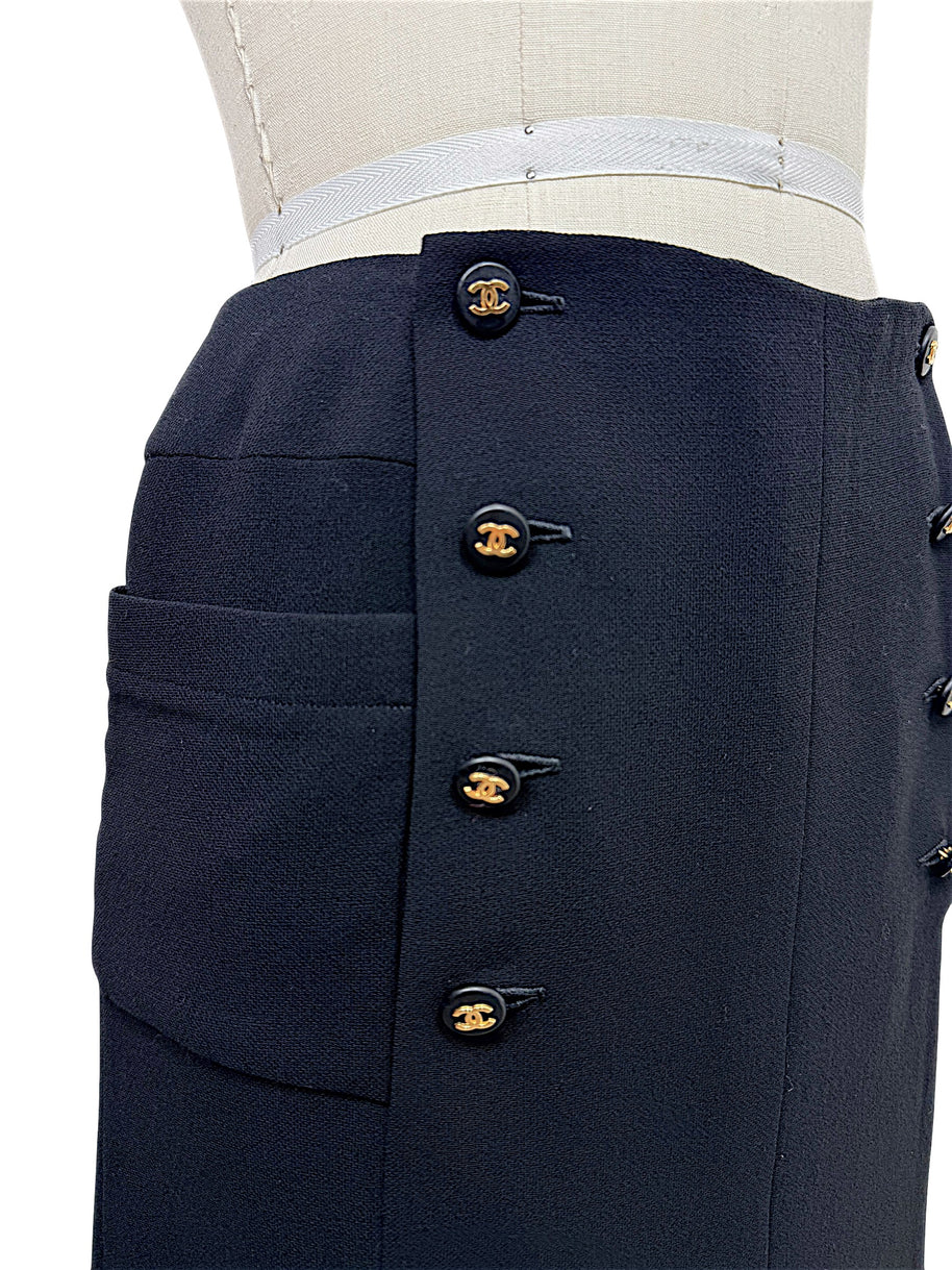 Chanel Spring 1997 black midi skirt showing concealed zipper, CC buttons and oversized front patch pocket