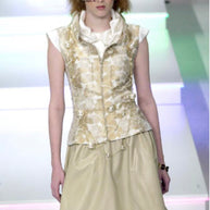 Chanel Spring Summer 2001 runway model wearing floral jacquard vest with pearl belt detail