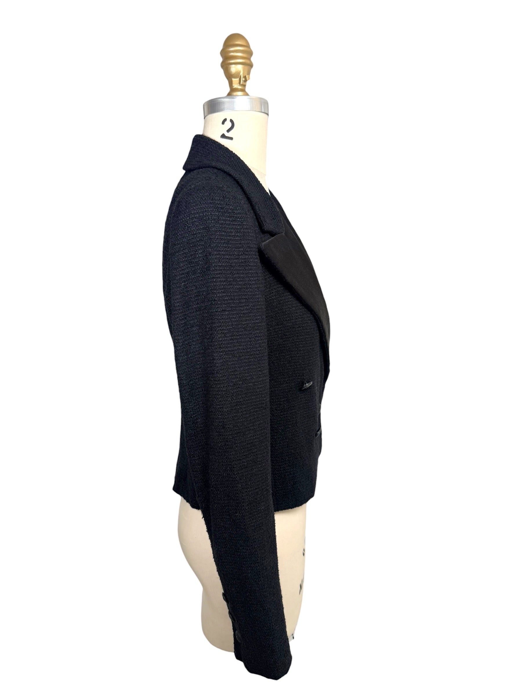 Side profile of documented Chanel Spring Summer 2005 cropped bouclé tuxedo jacket showing tailored fit and structured silhouette.