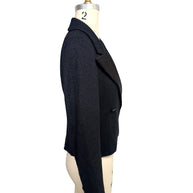 Side profile of documented Chanel Spring Summer 2005 cropped bouclé tuxedo jacket showing tailored fit and structured silhouette.