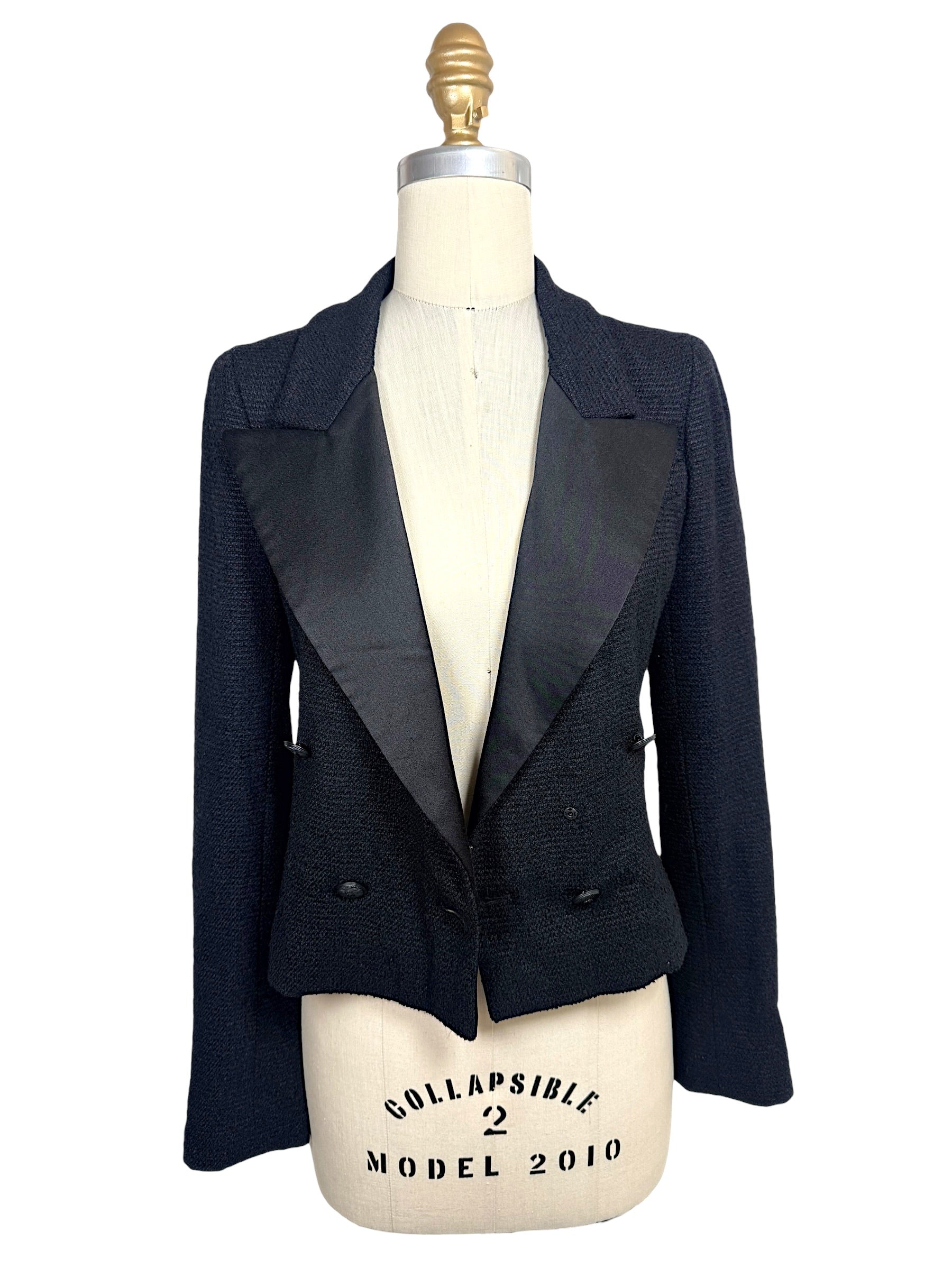Open front view of Chanel Spring Summer 2005 runway cropped bouclé tuxedo jacket showcasing oversized satin peak lapels.