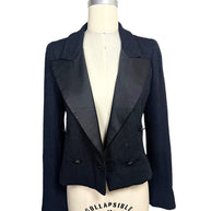 Open front view of Chanel Spring Summer 2005 runway cropped bouclé tuxedo jacket showcasing oversized satin peak lapels.