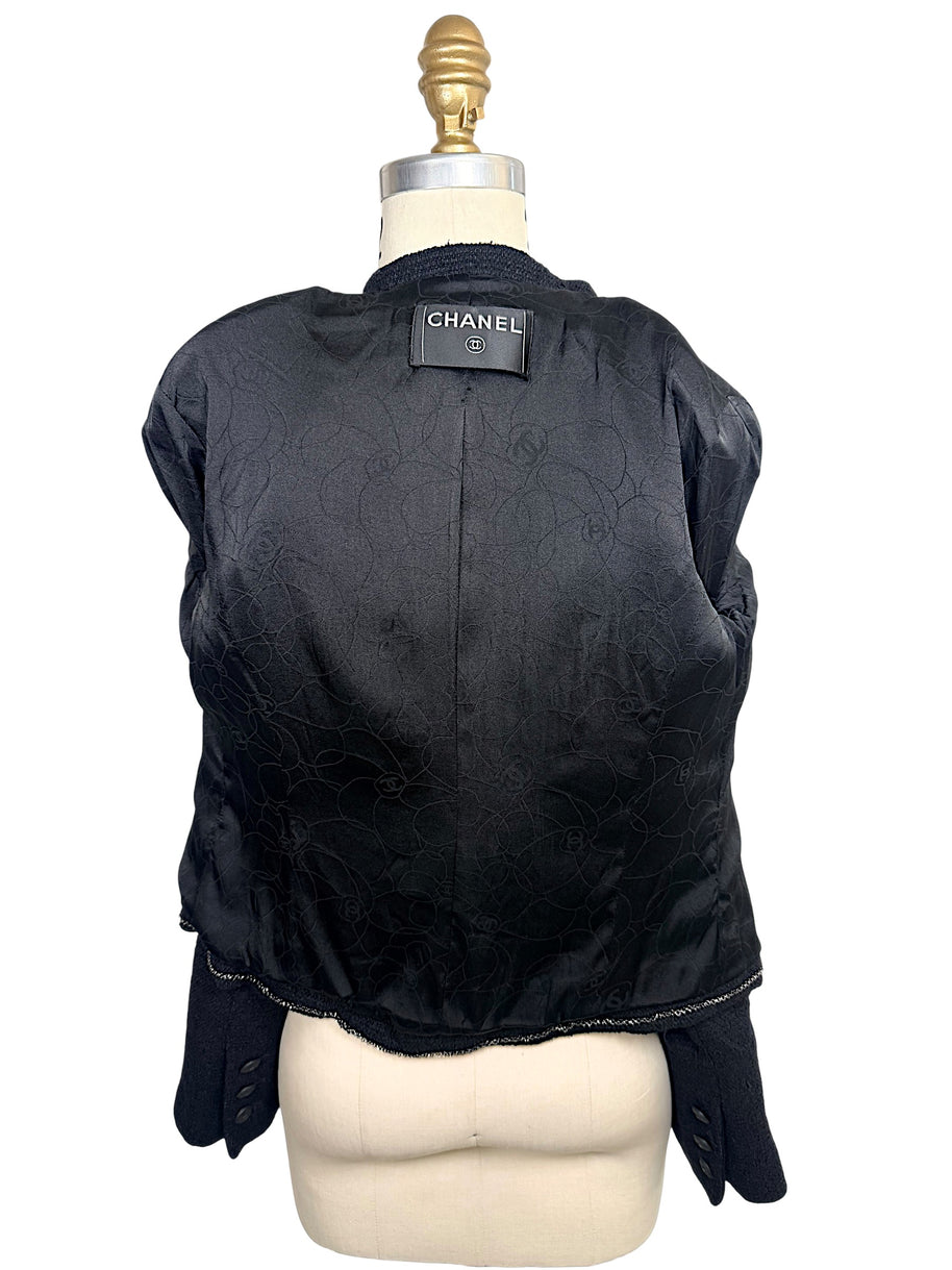Interior of Chanel Spring Summer 2005 runway jacket featuring black camellia jacquard silk lining and luxury tailoring.