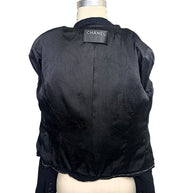Interior of Chanel Spring Summer 2005 runway jacket featuring black camellia jacquard silk lining and luxury tailoring.