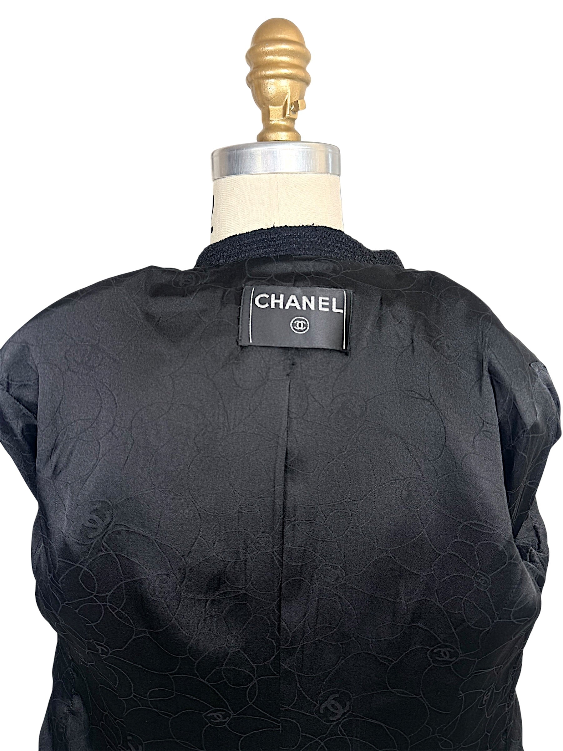 Authentic Chanel neck label inside Spring Summer 2005 runway cropped bouclé tuxedo jacket.