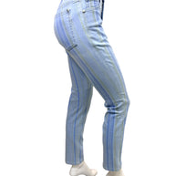 Side back view of Chanel Spring 2006 striped denim jeans showing slim fit silhouette and rear pocket detailing.