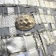 Chanel silver metallic woven skirt geometric CC logo button detail.