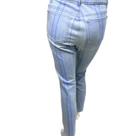 Rear view of Chanel pale blue striped denim jeans with tonal vertical stripe pattern and slim ankle cut.