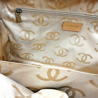 Full interior view of vintage Chanel Surpique Bowler bag featuring CC jacquard lining and zip storage pocket.