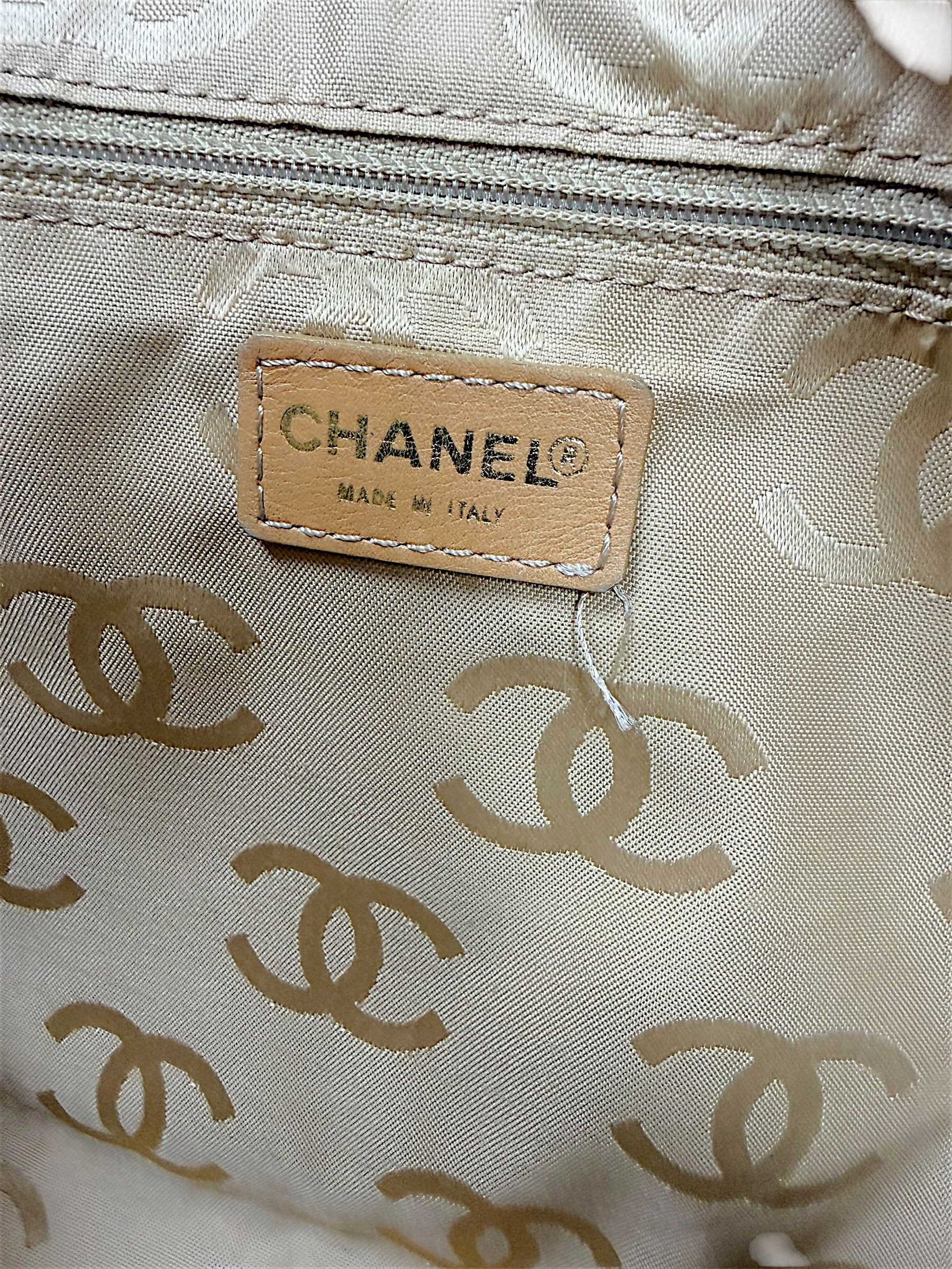Interior Chanel Made in Italy label inside vintage Surpique Bowler bag with beige CC jacquard lining.