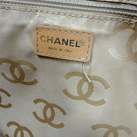 Interior Chanel Made in Italy label inside vintage Surpique Bowler bag with beige CC jacquard lining.