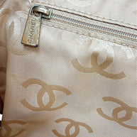 Interior zipper pocket detail with Chanel engraved pull and beige CC jacquard lining.